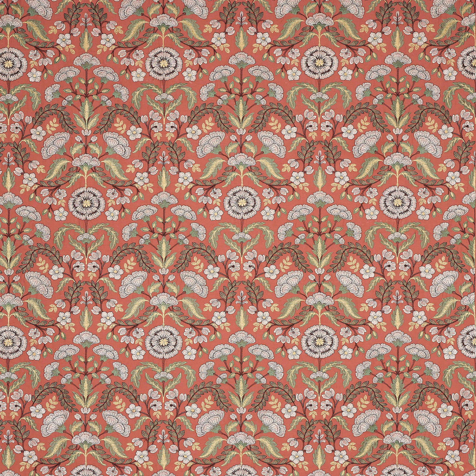 Coral-red floral fabric with cream blooms and muted green leaves