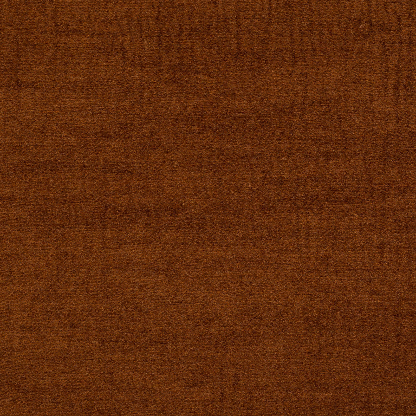 Close-up of warm spice-brown woven fabric with fine textured surface