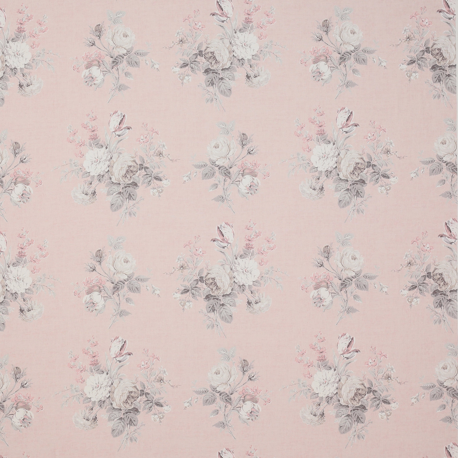Soft blush linen fabric with small faded floral bouquet motifs