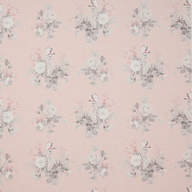 Soft blush linen fabric with small faded floral bouquet motifs