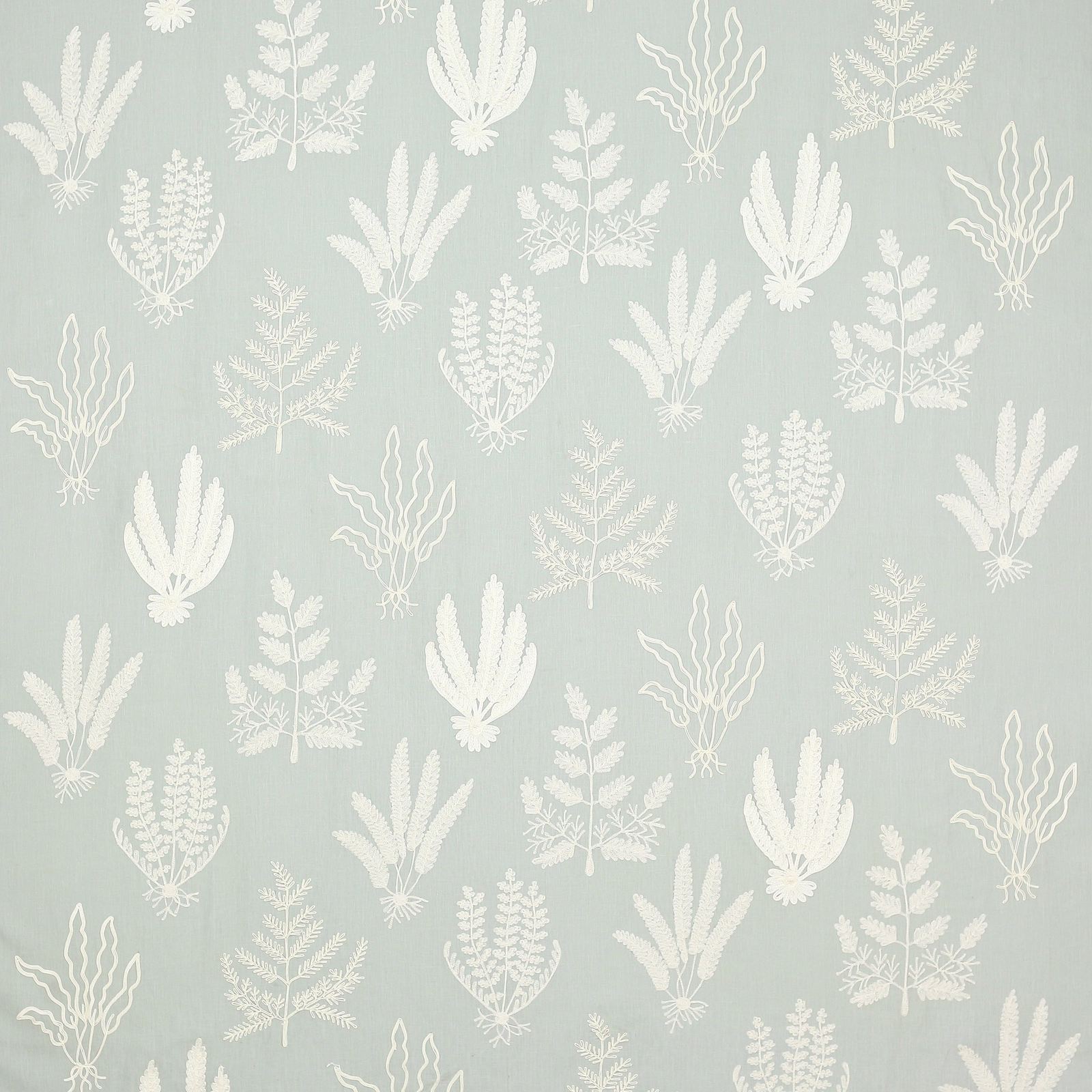 Pale dusty blue botanical fabric with white fern and leaf motifs