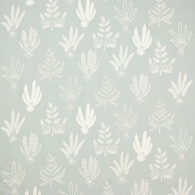 Pale dusty blue botanical fabric with white fern and leaf motifs