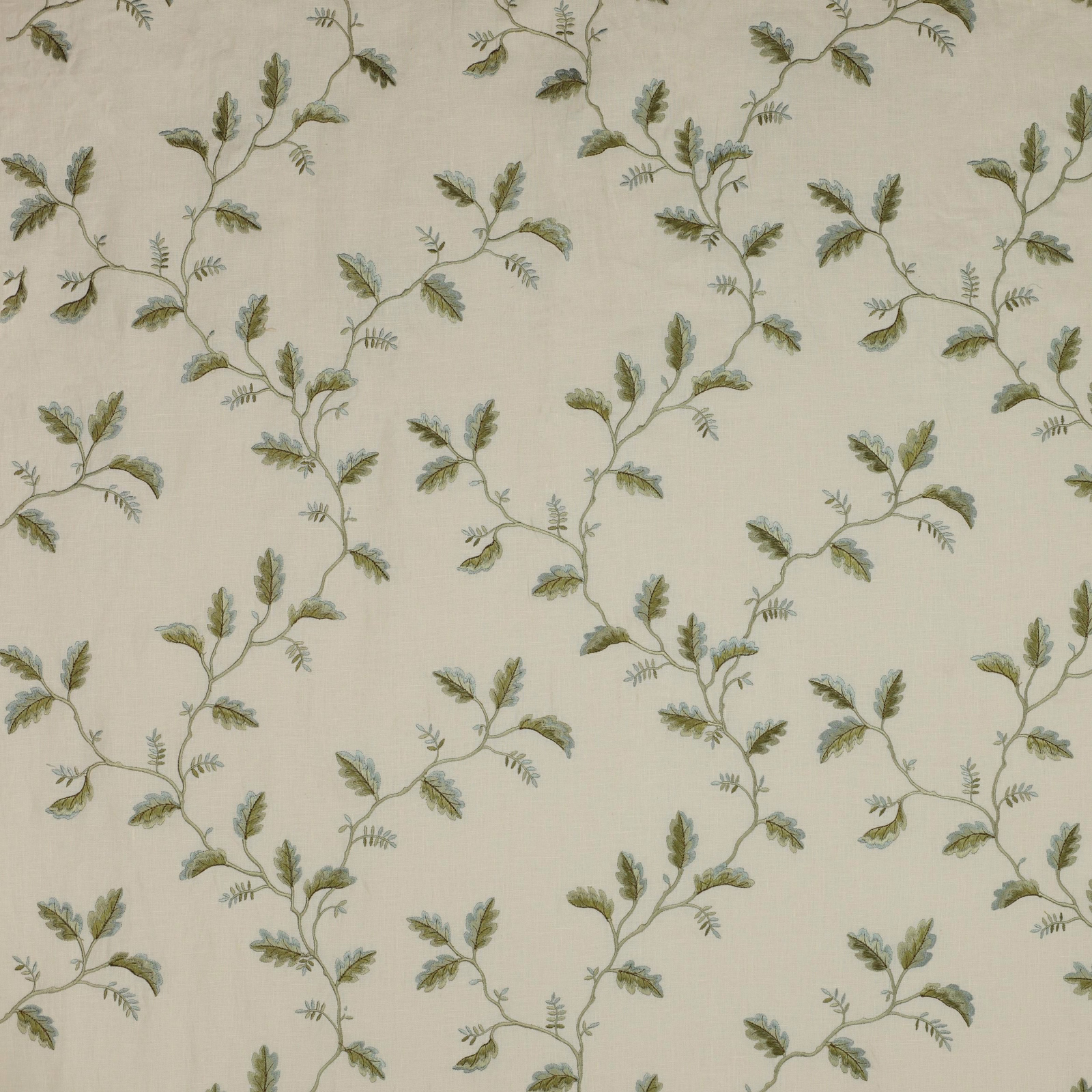 Cream fabric swatch with trailing sage green leaf vine pattern