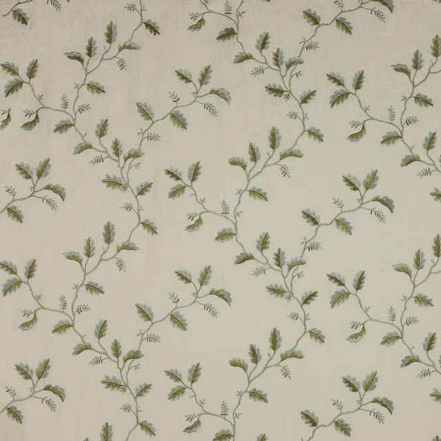 Cream fabric swatch with trailing sage green leaf vine pattern