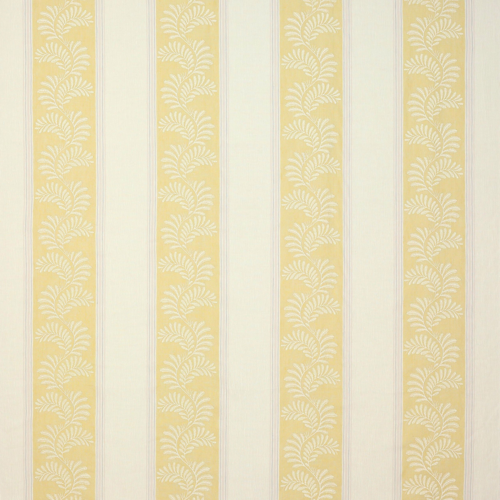 Pale yellow striped fabric with white leaf motif on a cream ground