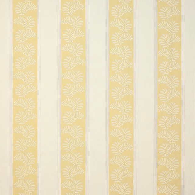 Pale yellow striped fabric with white leaf motif on a cream ground