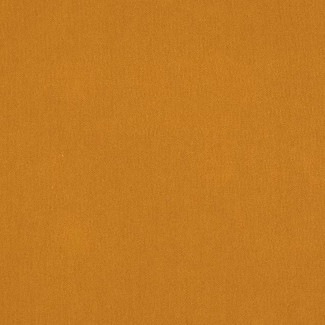 Solid caramel-gold fabric swatch with a smooth, matte plain weave