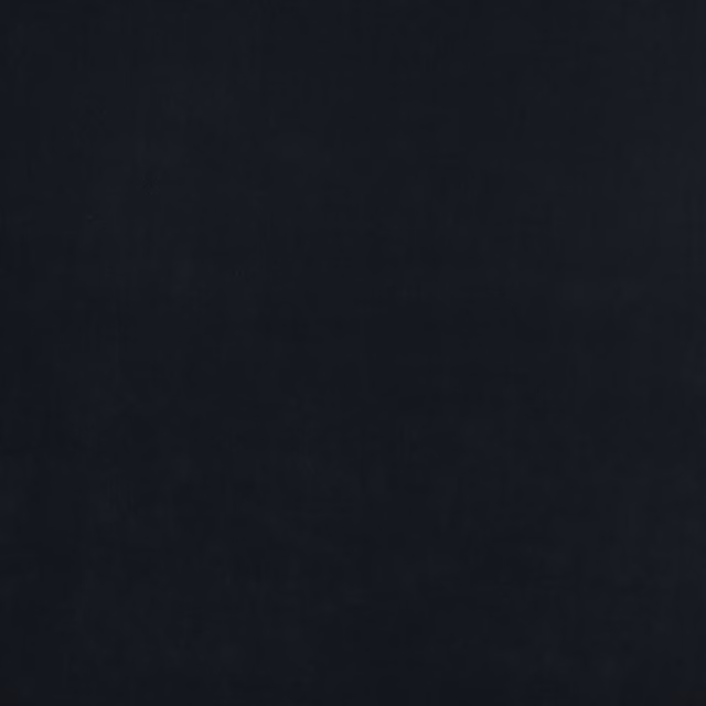 Dark charcoal plain fabric swatch with a smooth, matte finish