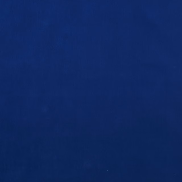 Deep cobalt blue plain fabric swatch with a smooth, even finish