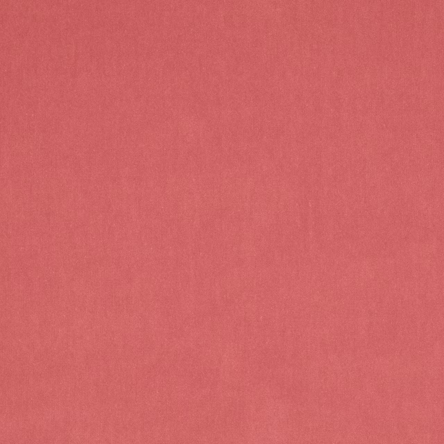 Plain warm coral pink fabric swatch with a fine woven texture