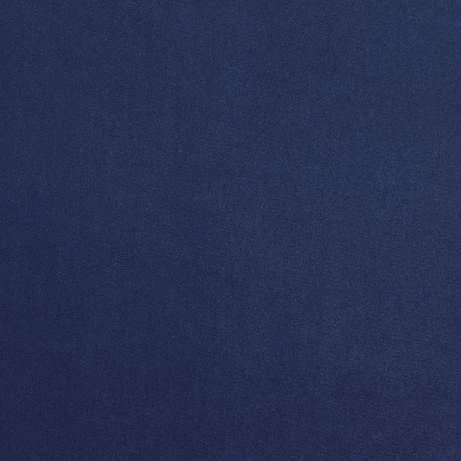 Solid deep indigo blue fabric with a fine, smooth weave