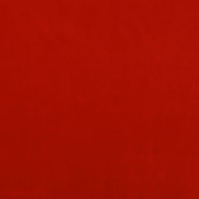 Solid deep red fabric swatch with a smooth matte weave