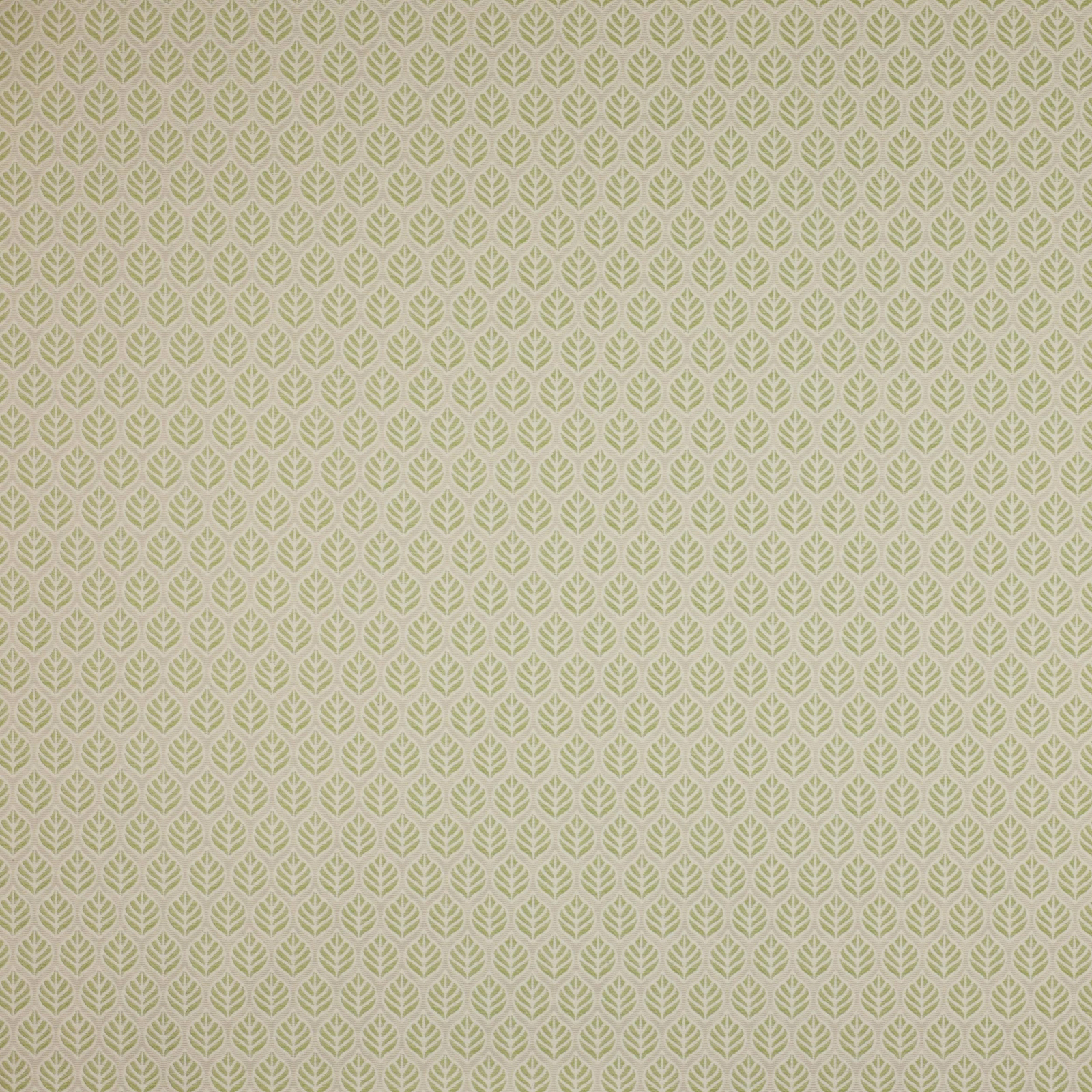 Small pale green leaf repeat on a warm neutral cotton fabric