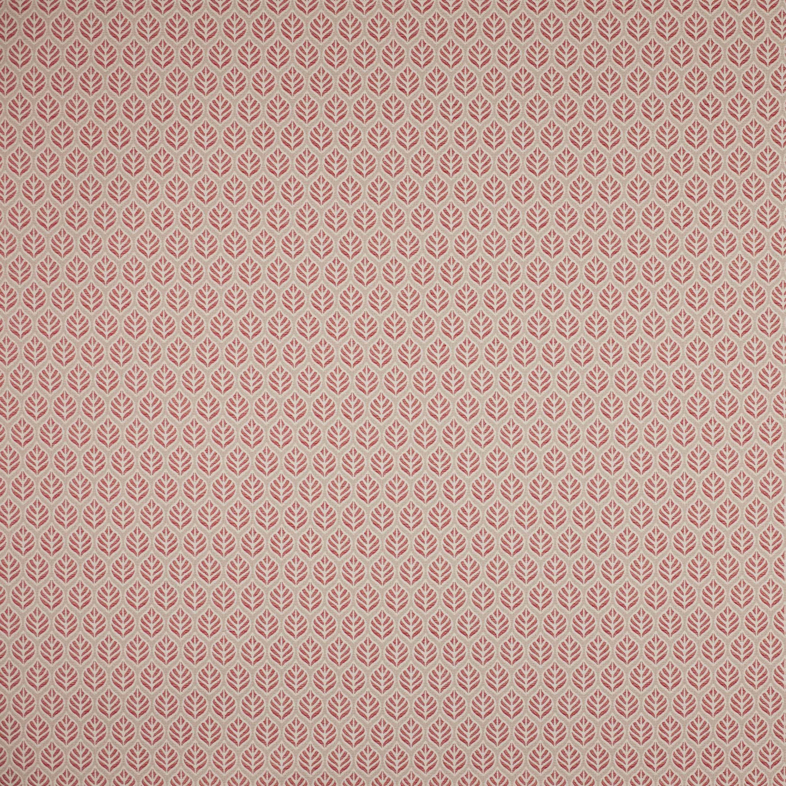 Small repeating leaf motif fabric in soft dusty red and pale ground