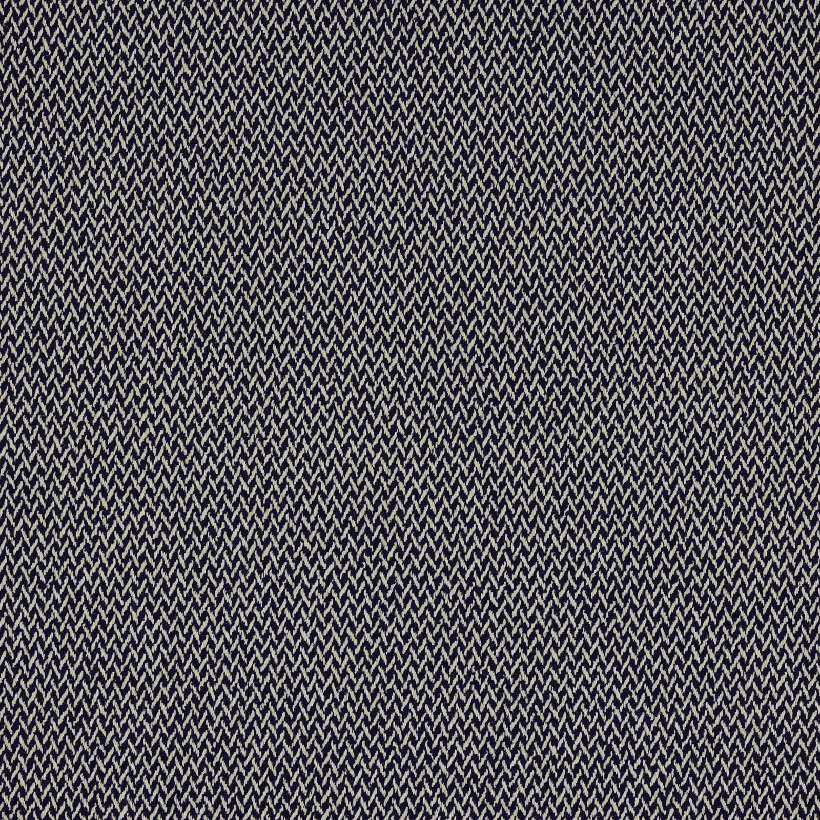 Close-up of deep indigo woven fabric with fine pale zigzag texture
