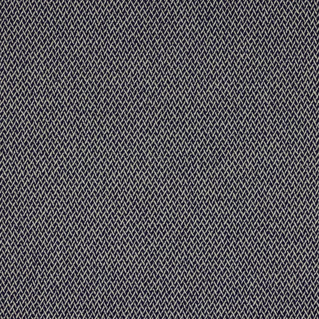 Close-up of deep indigo woven fabric with fine pale zigzag texture