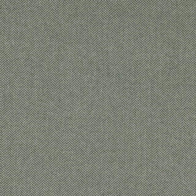 Close-up of muted sage green herringbone fabric with a finely textured weave