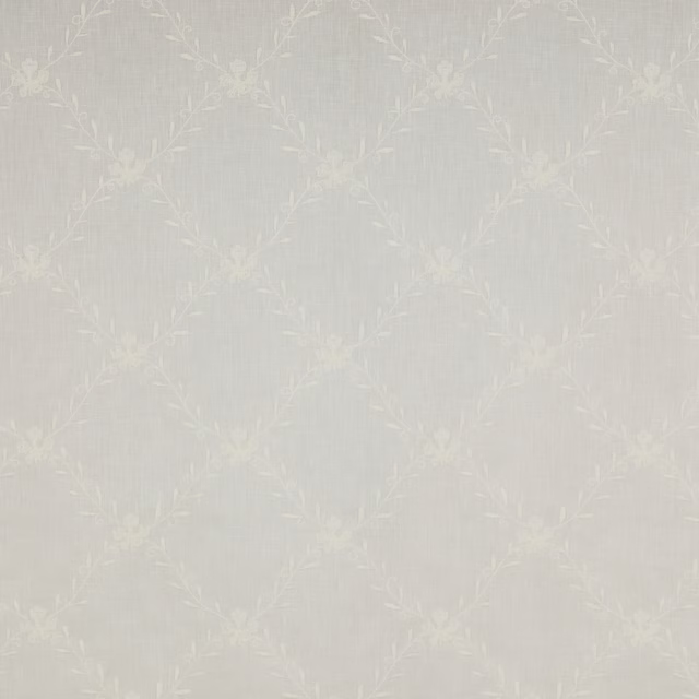 Pale ivory sheer fabric with a subtle floral trellis and leaf motif
