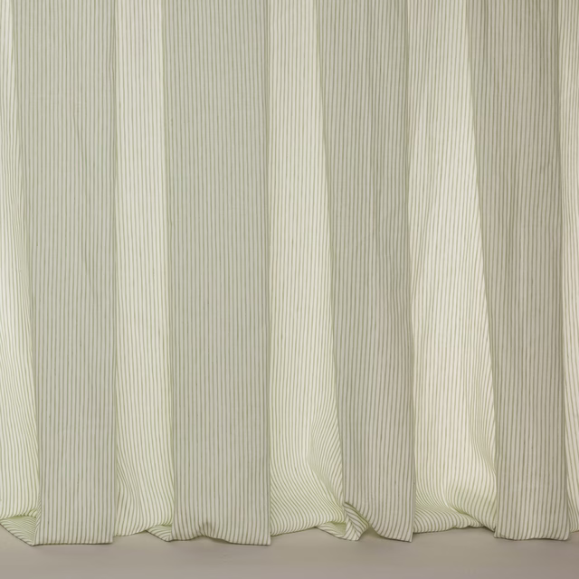 Soft ivory sheer fabric with fine vertical pinstripes and gentle folds