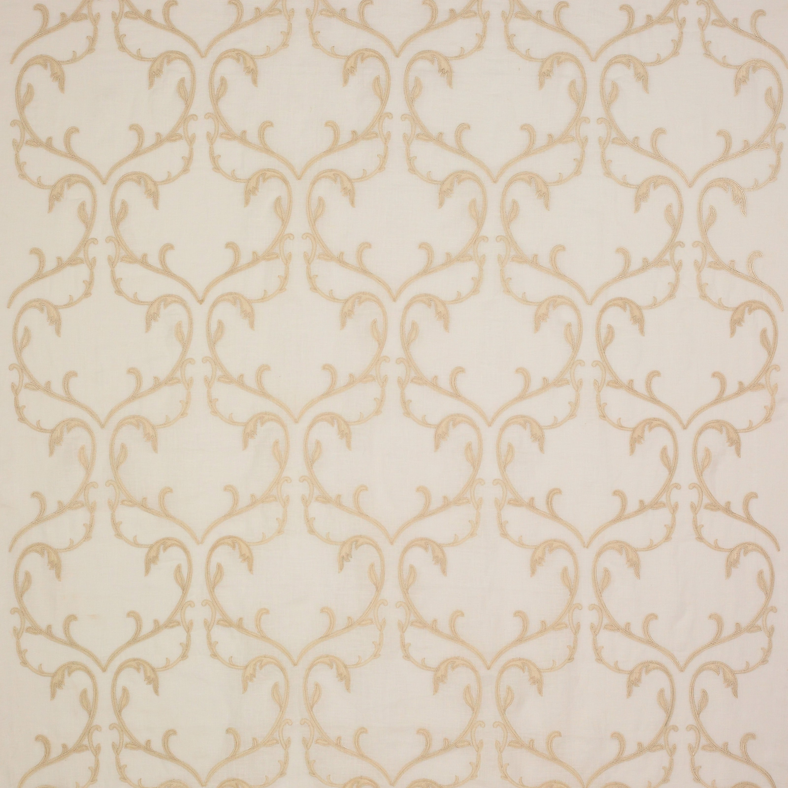Sheer ivory beige fabric with soft scrolling damask motif in pale gold tones