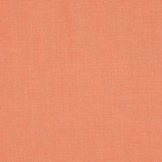 Warm coral-red plain linen swatch with fine natural weave