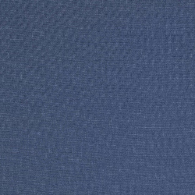 Close-up of muted slate blue linen fabric with a plain woven texture