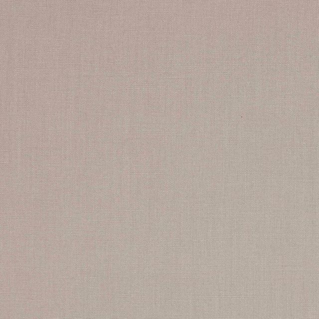 Close-up of soft bone-coloured plain linen weave with a natural matte texture.