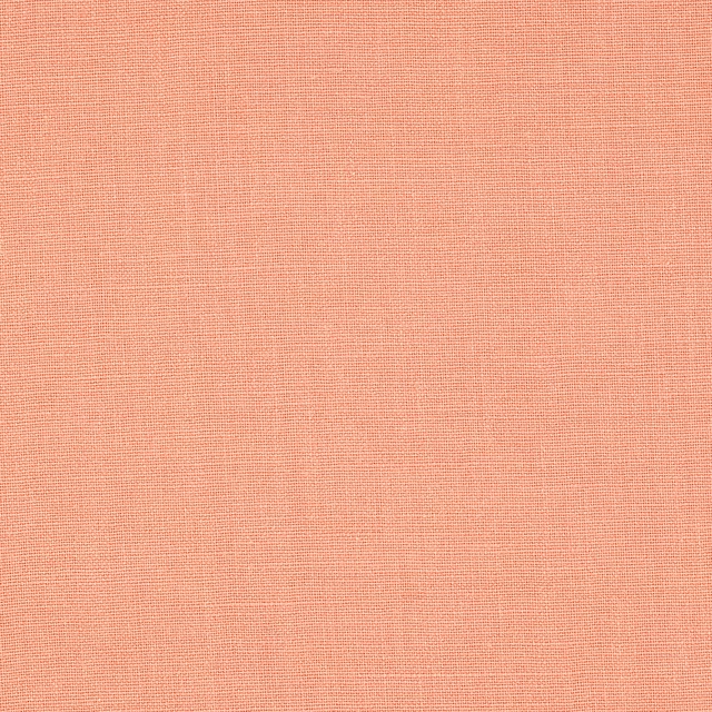 Soft cinnabar pink plain-woven linen swatch with fine texture