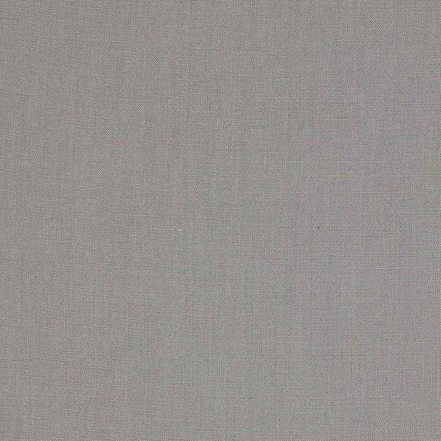 Close-up of pale silver-grey plain linen fabric with fine woven texture