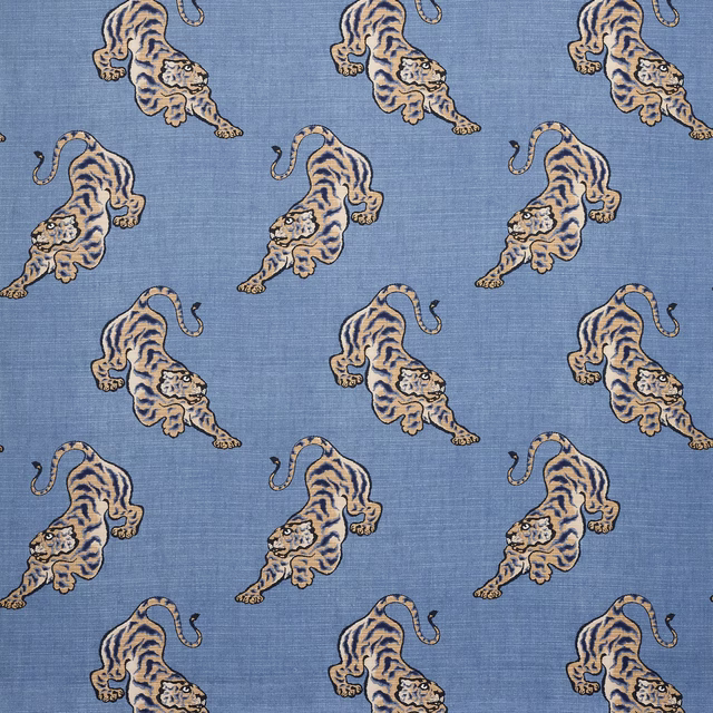 Blue linen fabric with repeated leaping tiger motif and textured weave