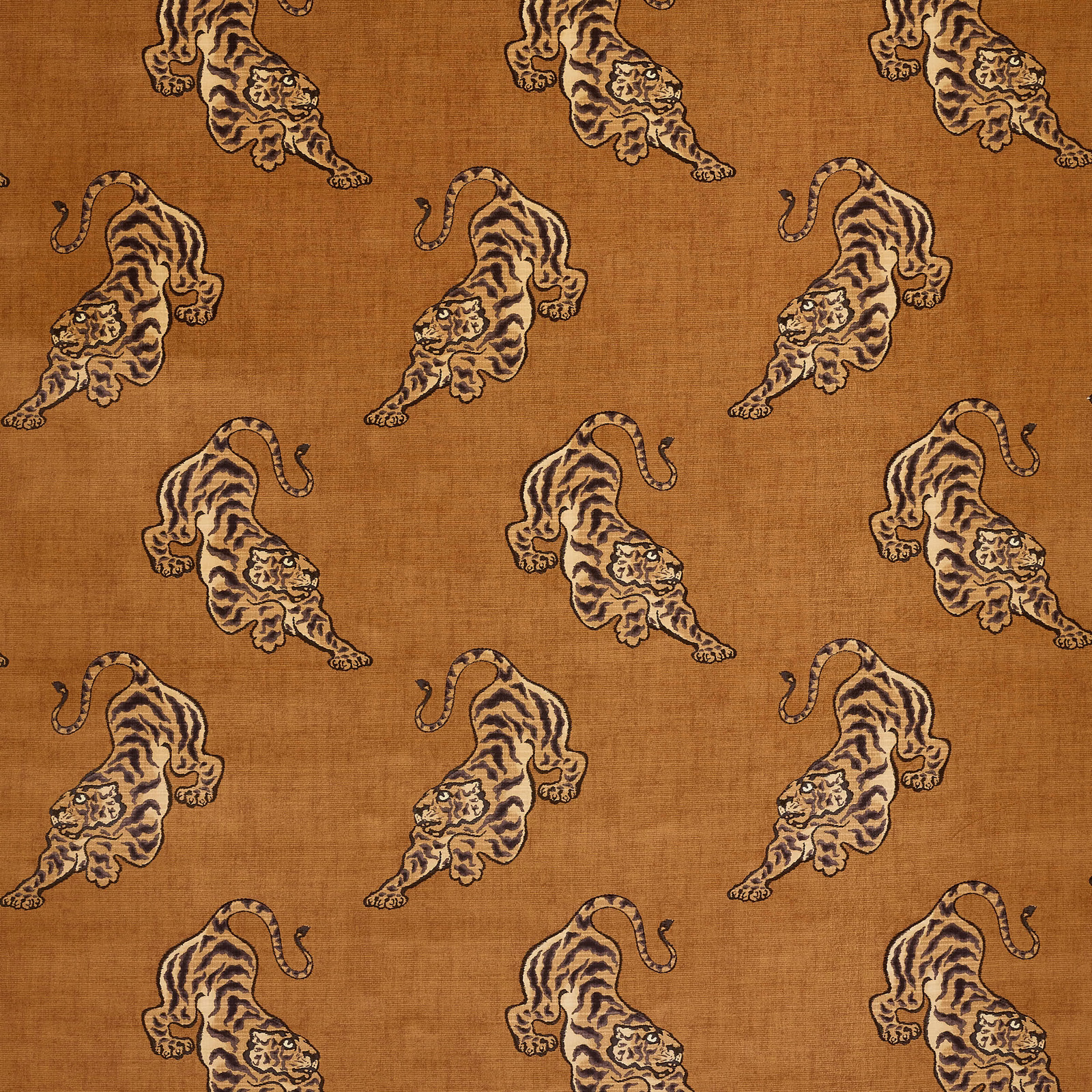 Camel textured fabric with repeating tiger motifs in brown and cream