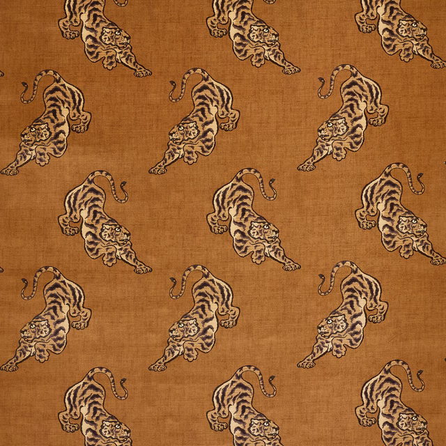 Camel textured fabric with repeating tiger motifs in brown and cream