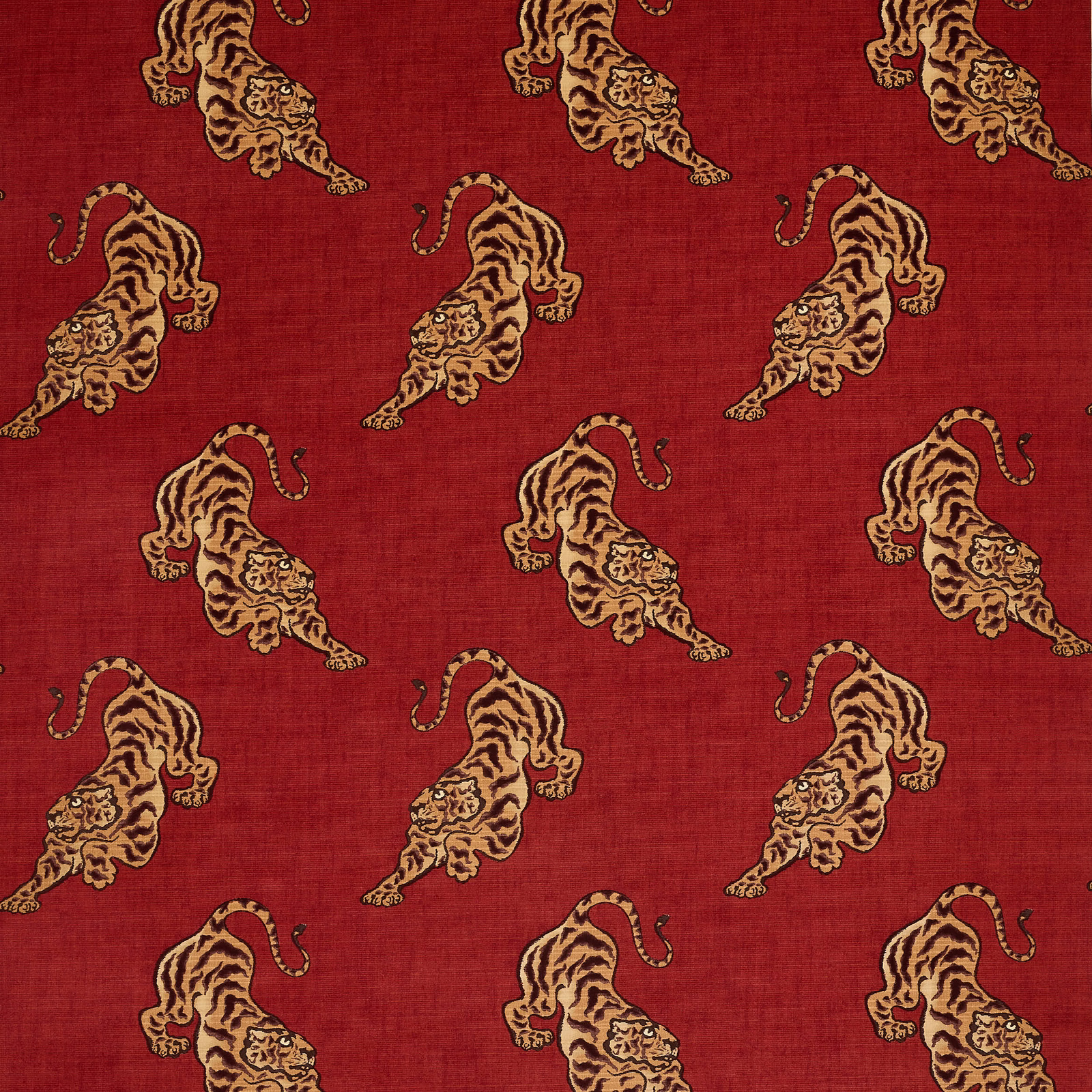 Red fabric swatch with repeating beige tiger motifs and a soft textured surface