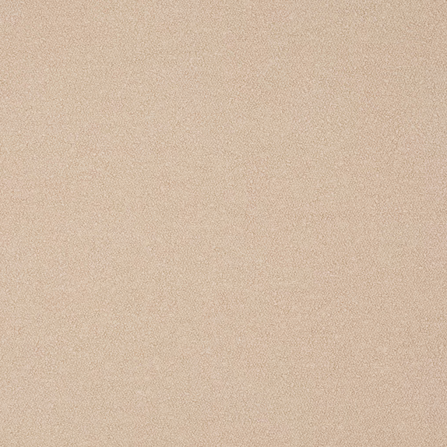 Close-up of soft warm beige plain fabric with a fine matte weave