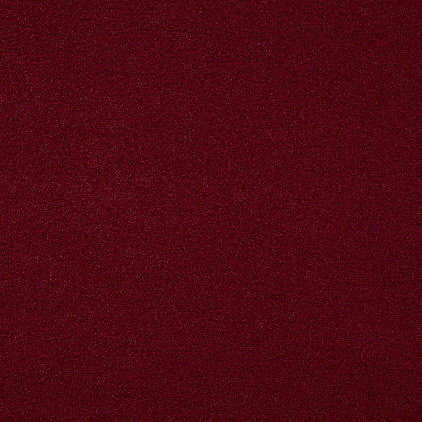 Deep ruby red textured fabric swatch with a fine speckled weave