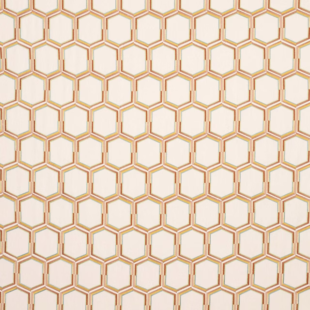 Hexagonal geometric fabric with terracotta and gold outlines on a pale ground