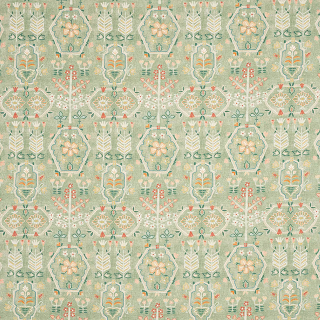 Sage green patterned fabric with ivory geometric motifs and small coral accents