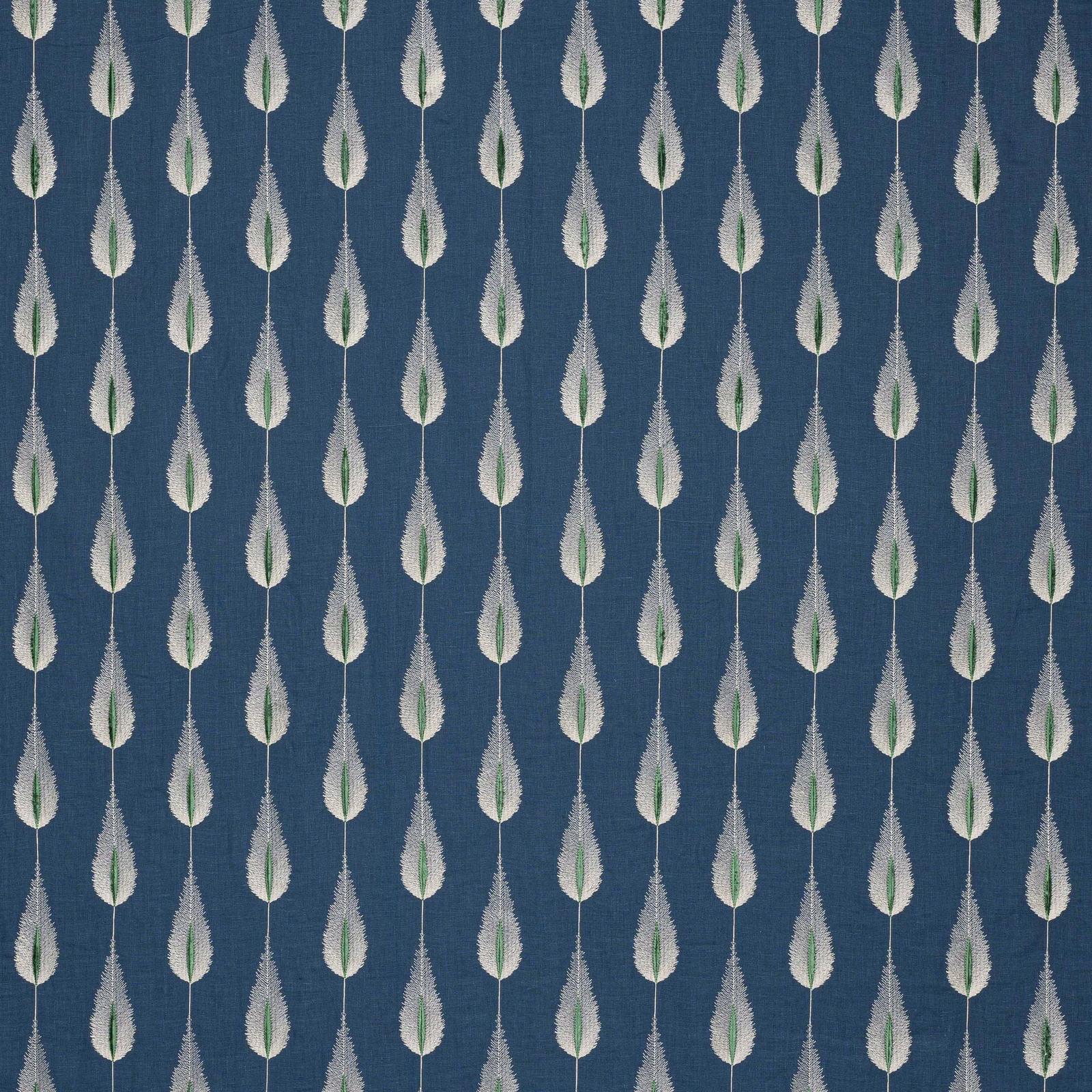 Navy blue fabric swatch with small repeated leaf motif in white and green