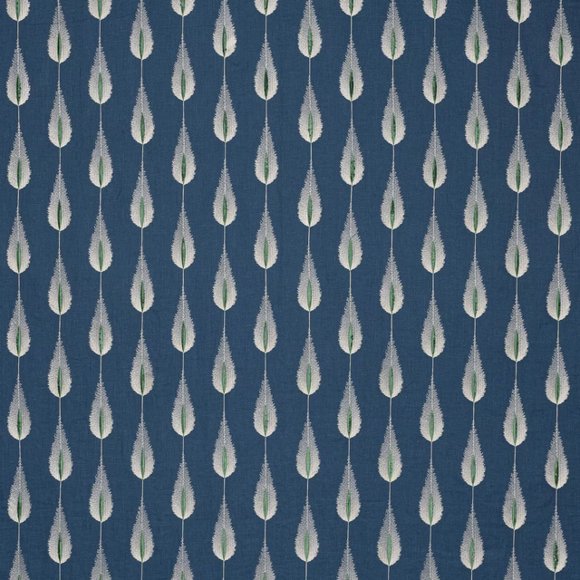 Navy blue fabric swatch with small repeated leaf motif in white and green
