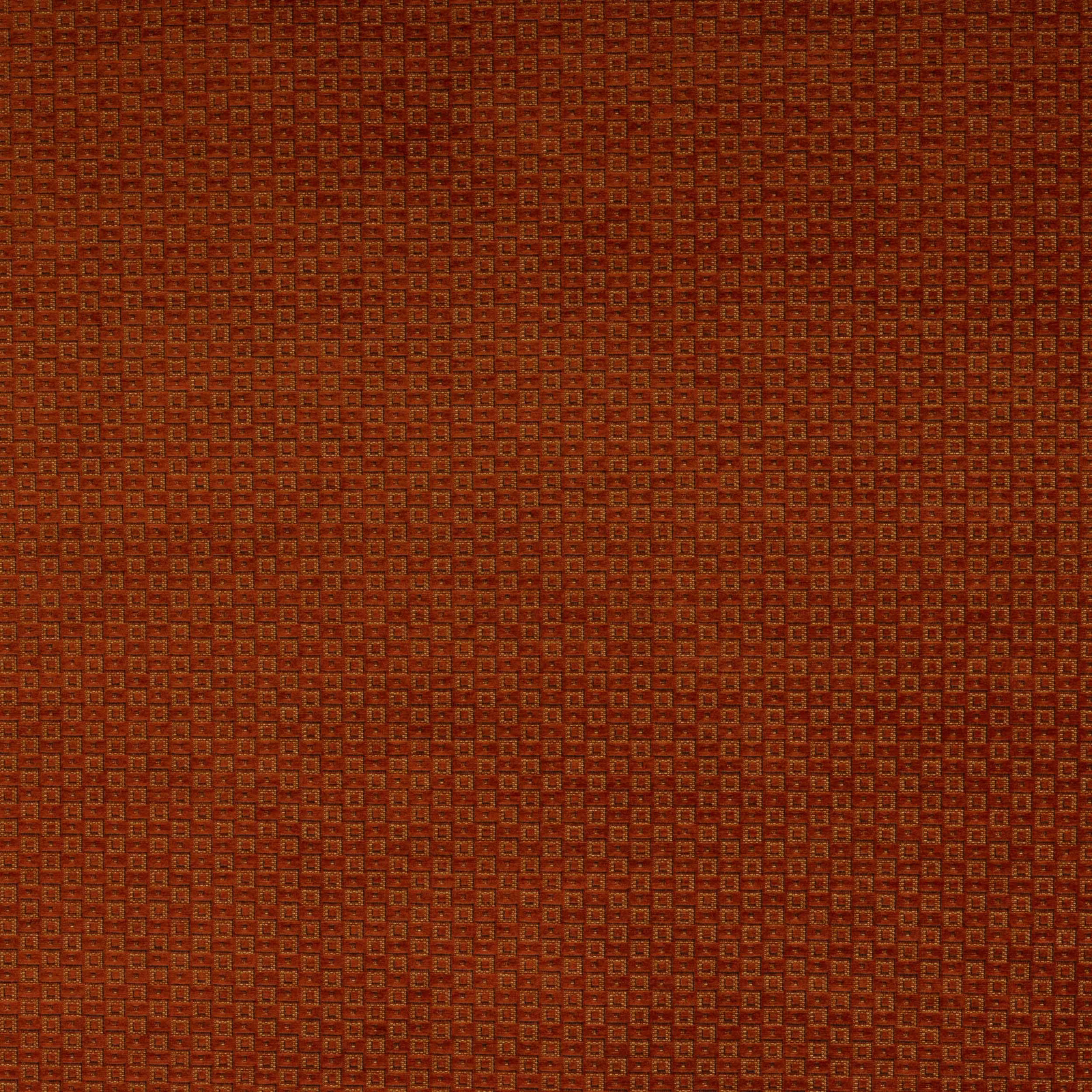 Close-up of Fulmar Paprika geometric fabric in burnt paprika orange and rust tones