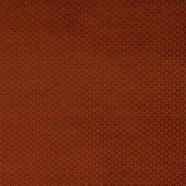 Close-up of Fulmar Paprika geometric fabric in burnt paprika orange and rust tones