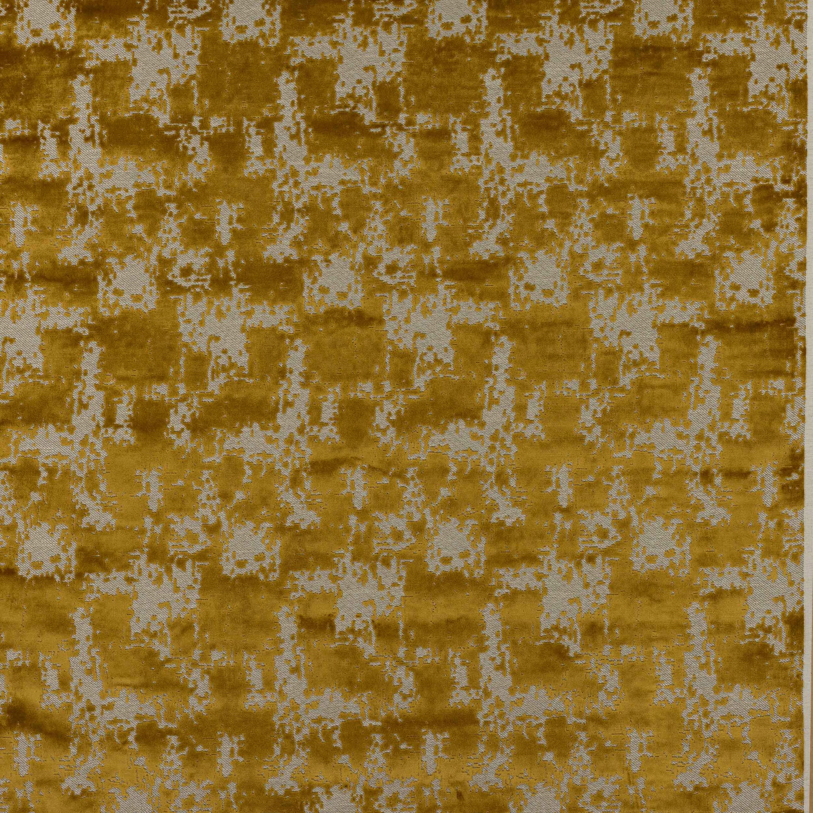 Golden ochre woven fabric with pale distressed geometric motif