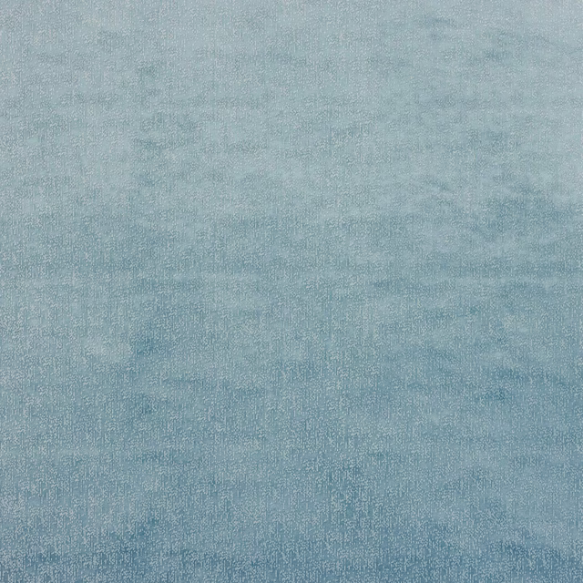 Soft misty blue woven fabric with a lightly mottled texture