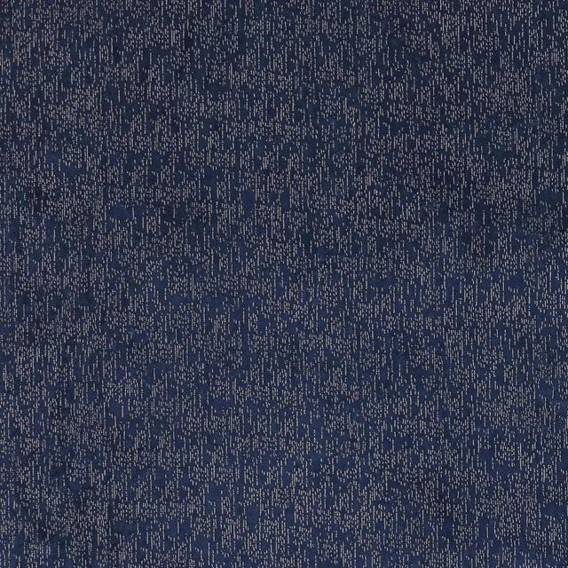 Dark indigo textured fabric with fine pale speckling