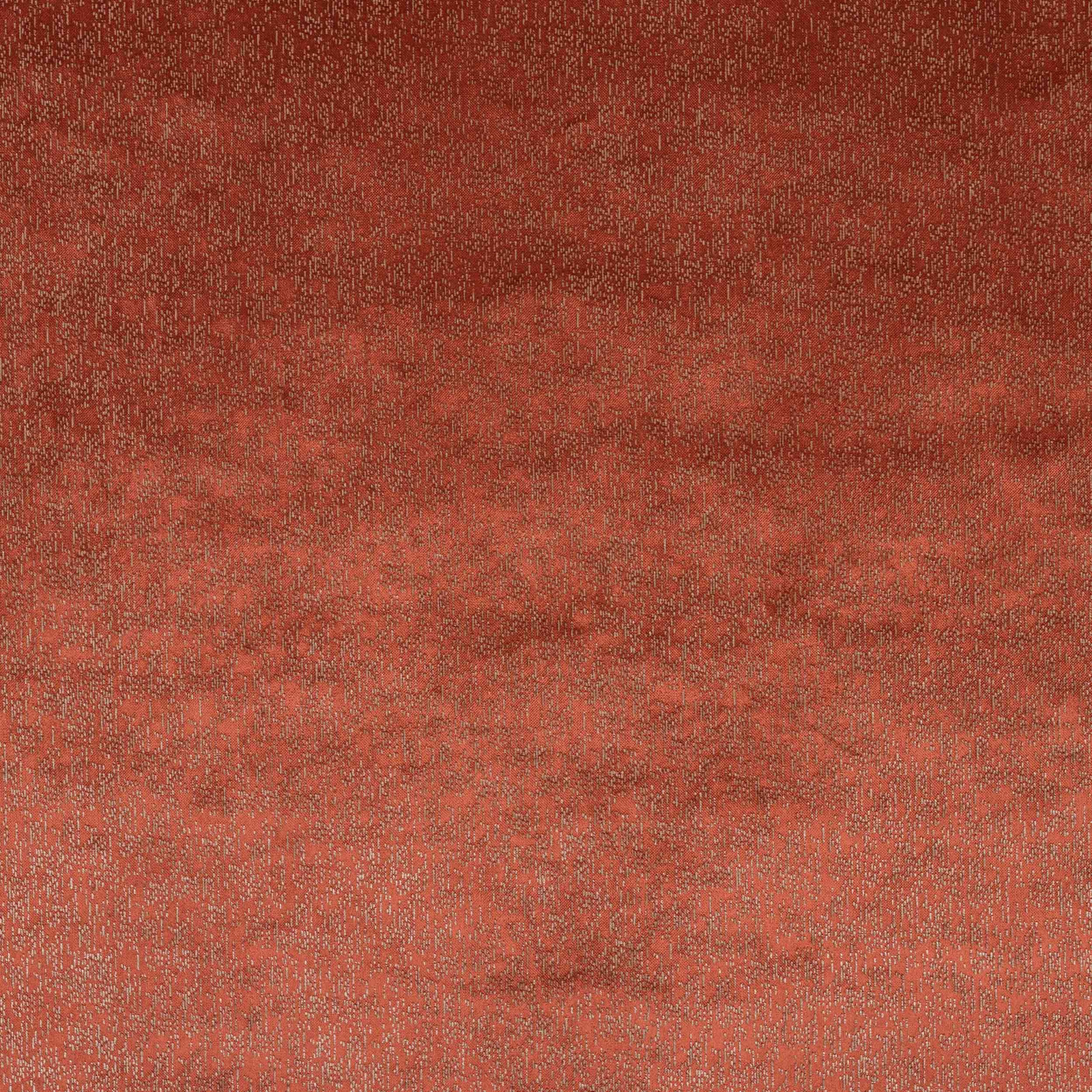 Textured terracotta-red fabric swatch with subtle mottled weave and darker shading