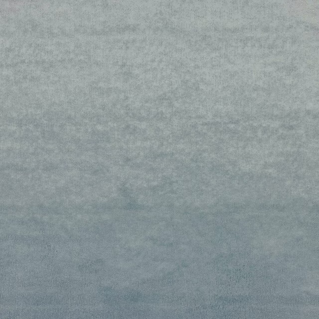 Muted slate blue fabric swatch with a softly mottled matte texture
