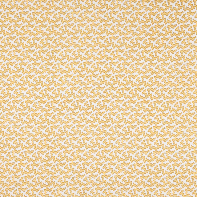 Close-up of a small geometric linen pattern in soft gold on ivory