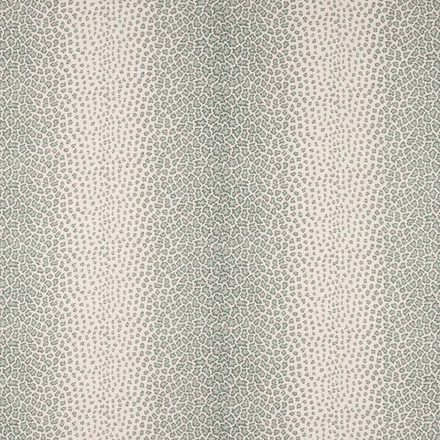 Close-up of pale ground fabric with tiny sage green scattered pattern