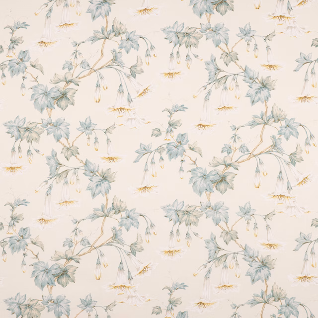 Ivory linen fabric with trailing aqua leaves and pale hanging floral sprigs