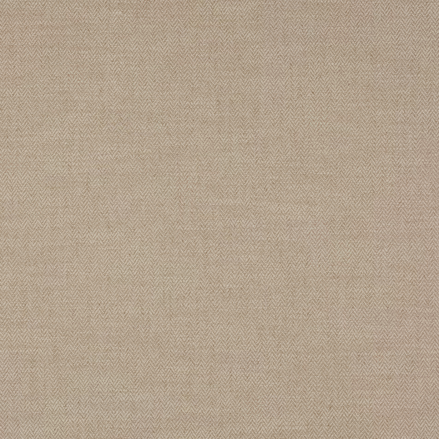 Close-up of warm beige herringbone-style fabric with a fine woven texture